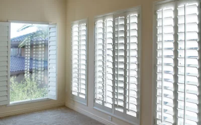 White plantation shutters on corner windows